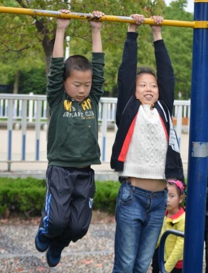 children on play equipment